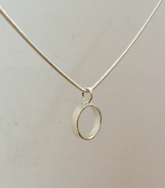 Circle - Sterling silver pendant on 16 inch snake chain