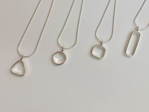 Triangle - Sterling silver pendant on 16 inch snake chain