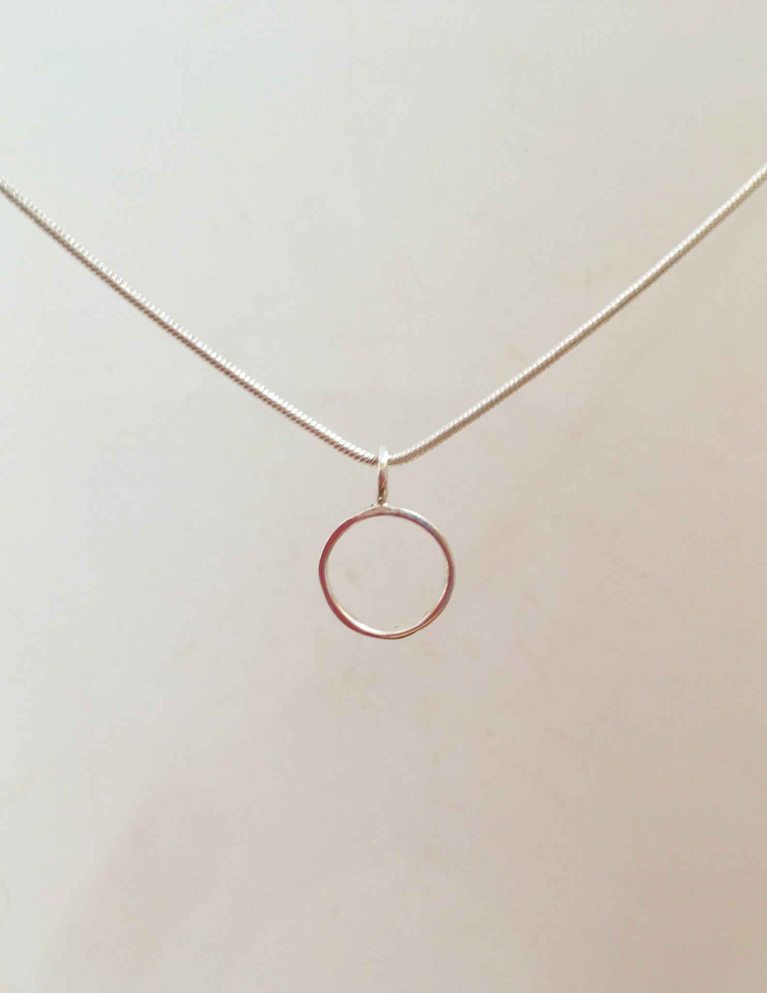 Circle - Sterling silver pendant on 16 inch snake chain